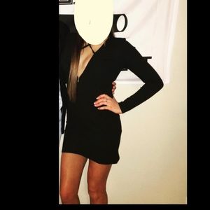 black mini dress with criss cross across the chest